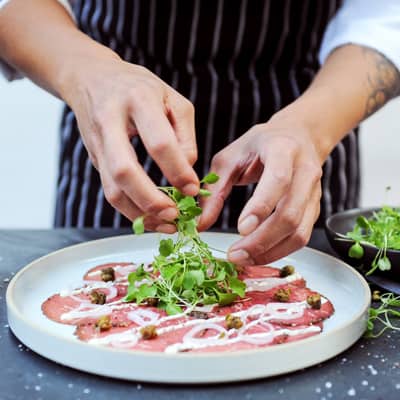 Peppercorn-crusted Certified Angus Beef®, dijon aioli, capers, grana padano, crostini.
