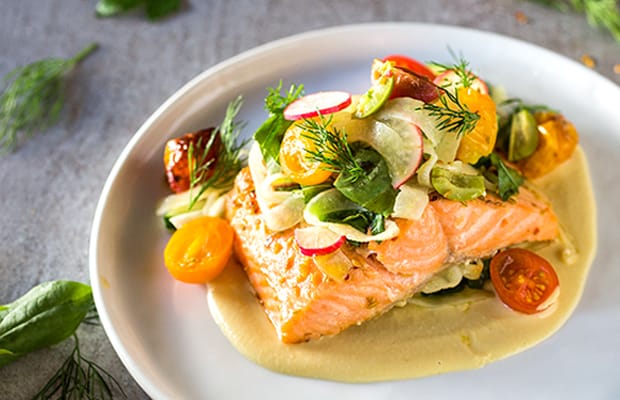 Created by Chef Cory Vitiello. ocean wiseTM lois lake steelhead, cucumber, baby gem tomatoes, green olives, shaved fennel, basil, dill, hummus.