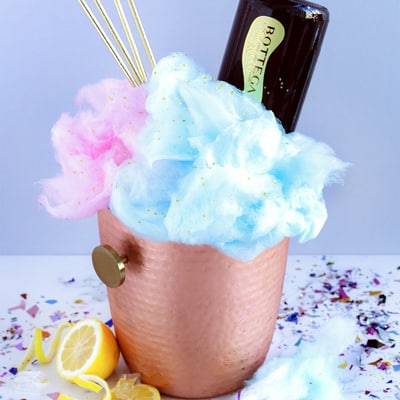 Gordons dry gin, lemon, orange, grapefruit, soda, finished with a bottle of sparkling wine and clouds of cotton candy.