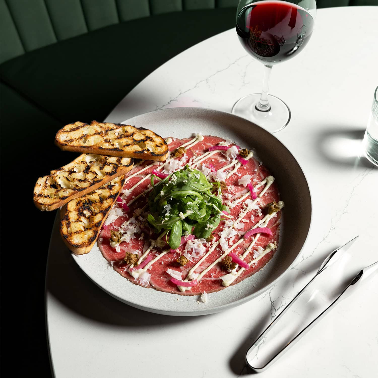 Beef Carpaccio with a glass of red wine